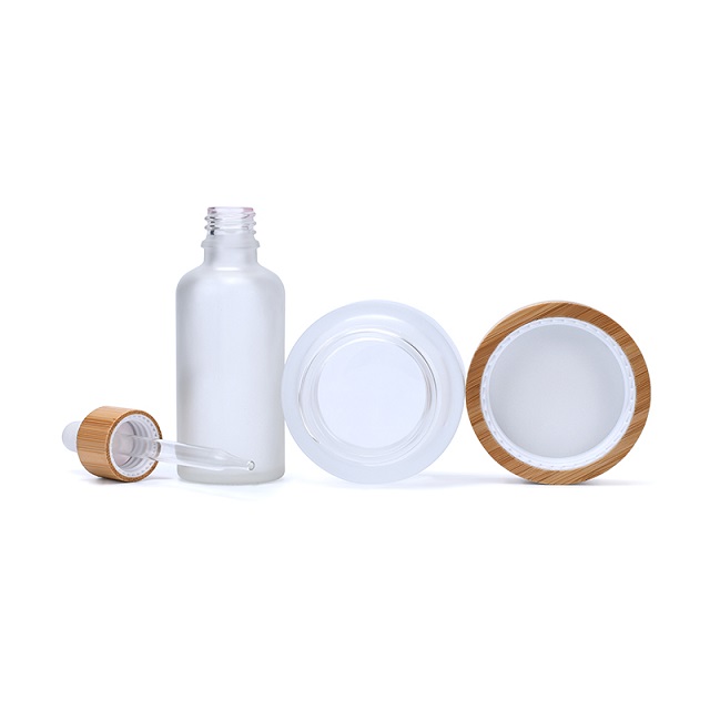 Набор матовых прозрачных янтарно-черных стеклянных бутылочек-капельниц для личного ухода за кожей и стеклянной банки с бамбуковой крышкой