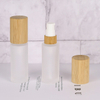 Роскошный 30 мл 50 мл 100 мл Пустой крем-лосьон для ухода за кожей Стеклянный спрей Круглый матовый прозрачный косметический флакон Упаковка с бамбуковой крышкой насоса